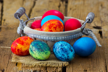 Happy Easter, colorful eggs in a basket