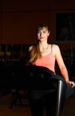 Fitness girl exercising in the gym. Sport, active lifestyle.