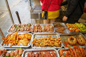 Grilled Foods of frog, chicken, vegetable, boar, pig spice ferment hot and spicy. BBQ Street food local delicacy in SAPA VIETNAM. Food is not clean.