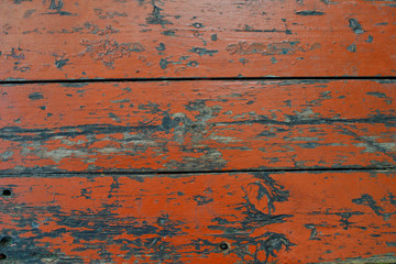 Orange fence of wooden planks.