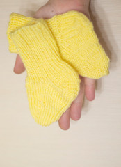 a little yellow knitted socks are on hand