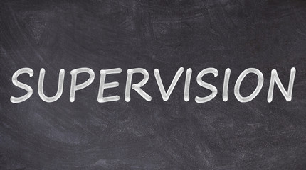 Obraz premium Supervision written on blackboard