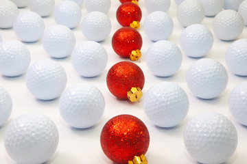 Pattern with white golf balls and red Christmas decoration