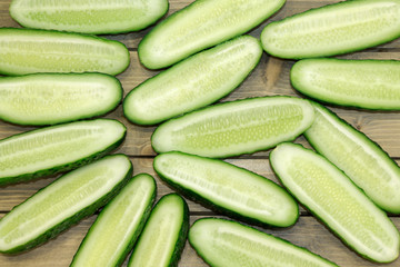 Fresh cucumber, chopped cucumber, isolated on wooden board