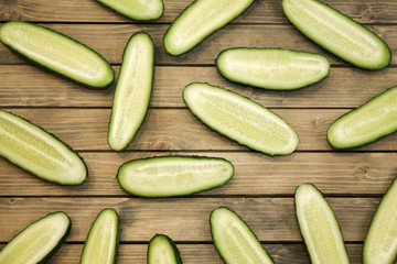 Fresh cucumber, chopped cucumber, isolated on wooden board