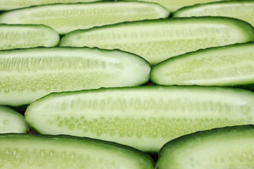 Fresh cucumber, chopped cucumber, isolated on wooden board