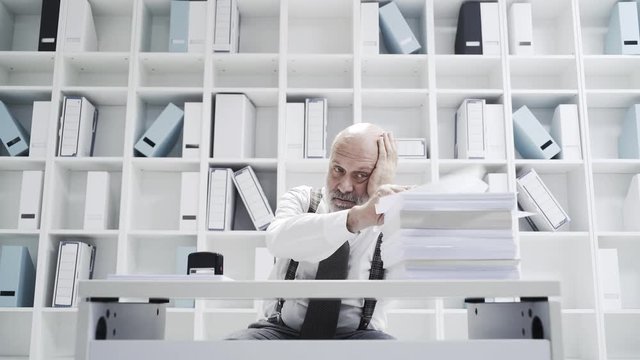 Office worker doing a boring repetitive job