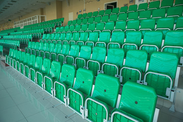 Yellow chairs inside the stadium, numbered