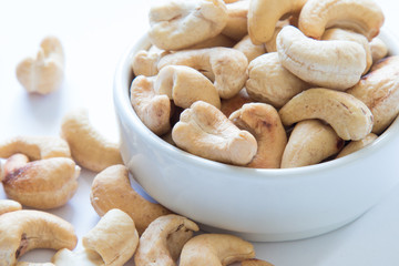 roasted cashew nuts on a white background