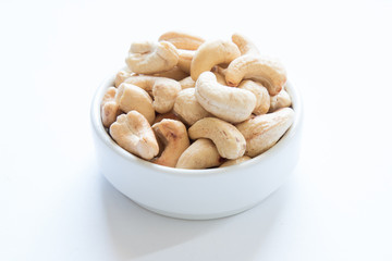 roasted cashew nuts on a white background