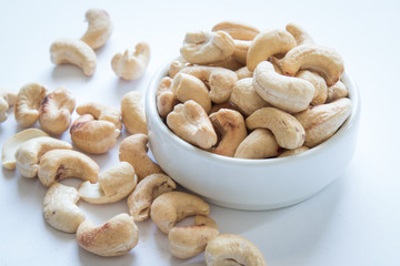 roasted cashew nuts on a white background