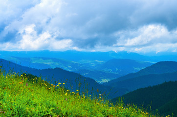 Obraz premium Landscape from height to mountain slopes, blue distance, meadow. Ukraine The Carpathians.