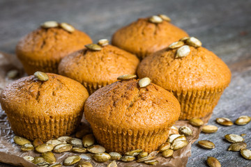 Pumpkin muffins on wooden background. Dietary product. Useful children's dessert. Bright. Seasonal product. Diet. Recipe