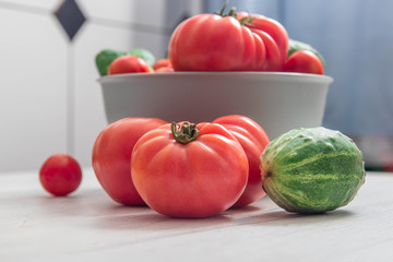 Heap of whole wet tomatoes and cucumbers, Top view, nutrition concept