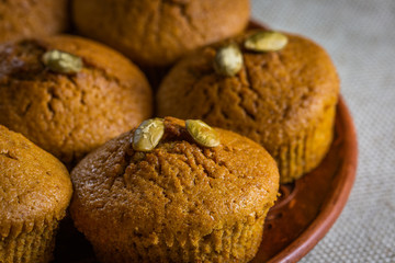 Pumpkin muffins on wooden background. Dietary product. Useful children's dessert. Bright. Seasonal product. Diet. Recipe