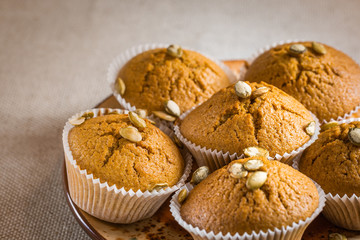 Pumpkin muffins on wooden background. Dietary product. Useful children's dessert. Bright. Seasonal product. Diet. Recipe