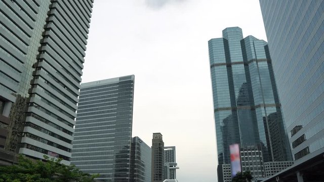 Office buildings in the business district of downtown at cloudy sky background