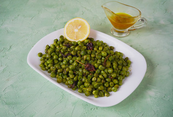 Indian Spiced Peas. Traditional Indian garnish of fried green peas with spices.