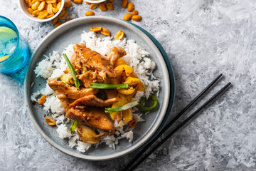 Kung Pao chicken, stir-fried Chinese sichuan traditional sichuan  dish with chicken, peanuts, vegetables and chili peppers.