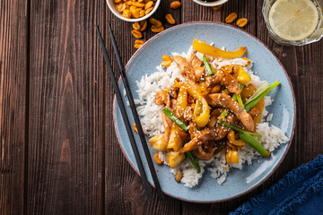 Kung Pao chicken, stir-fried Chinese sichuan traditional sichuan  dish with chicken, peanuts, vegetables and chili peppers.