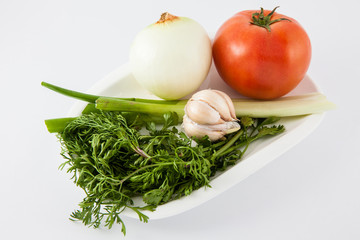 Ingredients to prepare a traditional sauce called hogao used to season the typical Colombian food