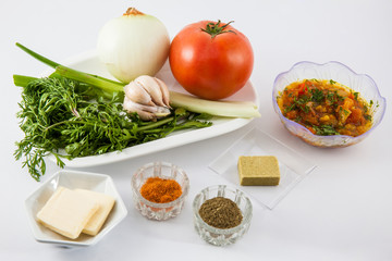 Ingredients to prepare a traditional sauce called hogao used to season the typical Colombian food