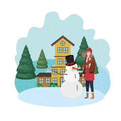 woman with snowman and house in winter