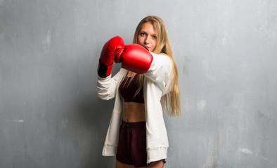 Young sport woman with boxing gloves