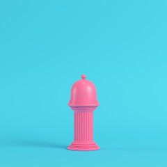 Pink plate with dome on ancient column bright blue background in pastel colors