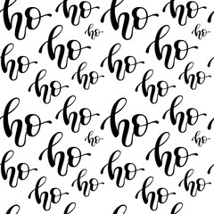 Christmas seamless pattern with hand lettering quote 'ho ho ho'