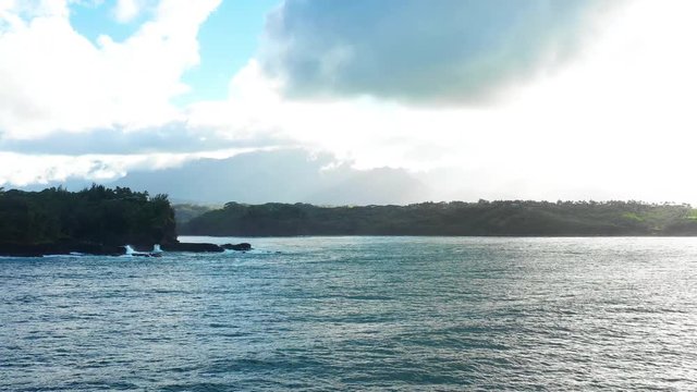 Kauai Ocean View Aerial Rotating Panning Shot Swell Breaking on Rocks High Tide