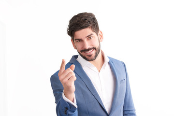 Businessman pointing his finger at you. Studio portrait.