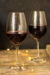 wine, red wine, transparent glass on a wooden table, a gift. Top view. copy space