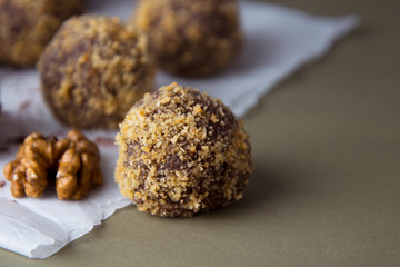 Energy healthy homemade truffles. Uncooked sweet balls made from walnuts and biscuits.
