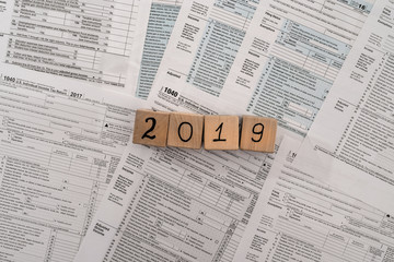 Fototapeta premium Wooden cubes on 1040 individual tax form