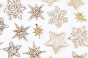 Fototapeta na wymiar Christmas composition. Stars decorations, on white background. Christmas, winter, new year concept. Flat lay, top view, copy space.