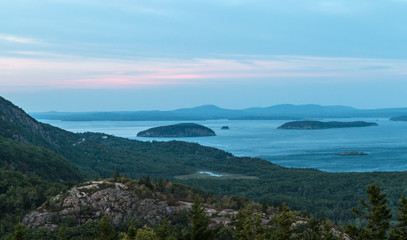 A landscape view of the coast of Maine in Acadia National Park with the Atlantic Ocean