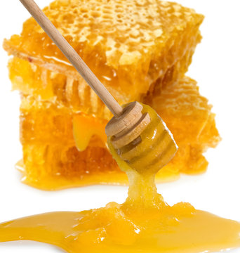 isolated image of honey in honeycombs close up