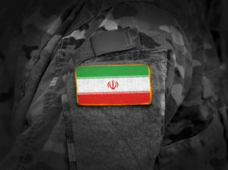 Flag of Iran on soldiers arm (collage).