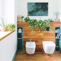 Cozy and mediterranean style bathroom in warm colours and natural wood.