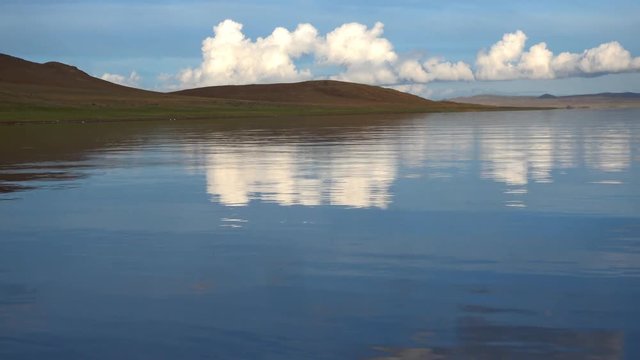 Calm Waters Of Mongolian Lake Telmen Lake Surrounded By Hills. Mongolia.