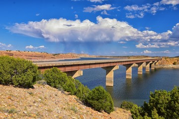 Starvation State Park Reservoir Late Summer early Fall panorama of lake around bridge with rain clouds near Duchesne on US Highway 40, in the Uinta Basin Range of Utah United States, USA