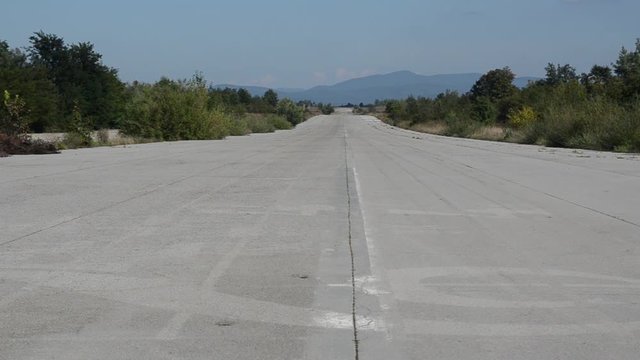 Abandoned Runway of Zeljava Underground Airbase on the Croatian-Bosnian border. Yugoslavia's largest and secret underground airport in ruins. Landing strip at former military airfield. Objekat 505.  
