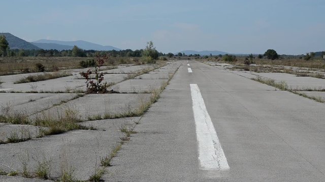 Abandoned Runway of Zeljava Underground Airbase on the Croatian-Bosnian border. Yugoslavia's largest and secret underground airport in ruins. Landing strip at former military airfield. Objekat 505.  