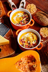 traditional pumpkin cream soup in a rustic style. healthy eating concept.