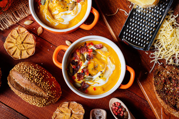 traditional pumpkin cream soup in a rustic style. healthy eating concept.