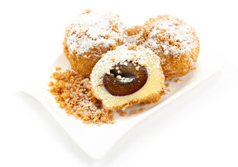 Plum dumplings on white background
