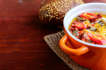 traditional pumpkin cream soup in a rustic style. healthy eating concept.