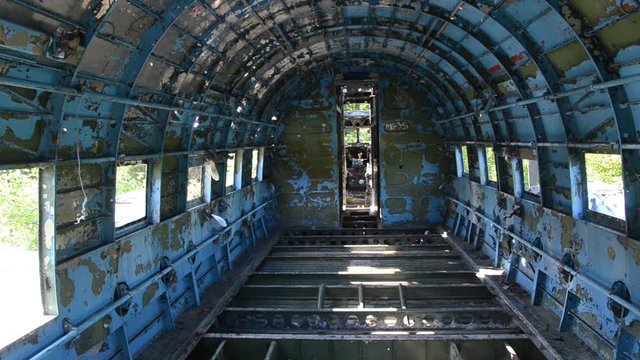 Inside of wreck of Douglas C-47. Old Abandoned plane at Yugoslav Air Base Zeljava on the Croatian-Bosnian border. Yugoslavia's largest and secret underground airport.  Zeljava Underground Airbase 