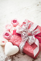 Fototapeta na wymiar Valentine's Day and mothers day concept, red gift box
